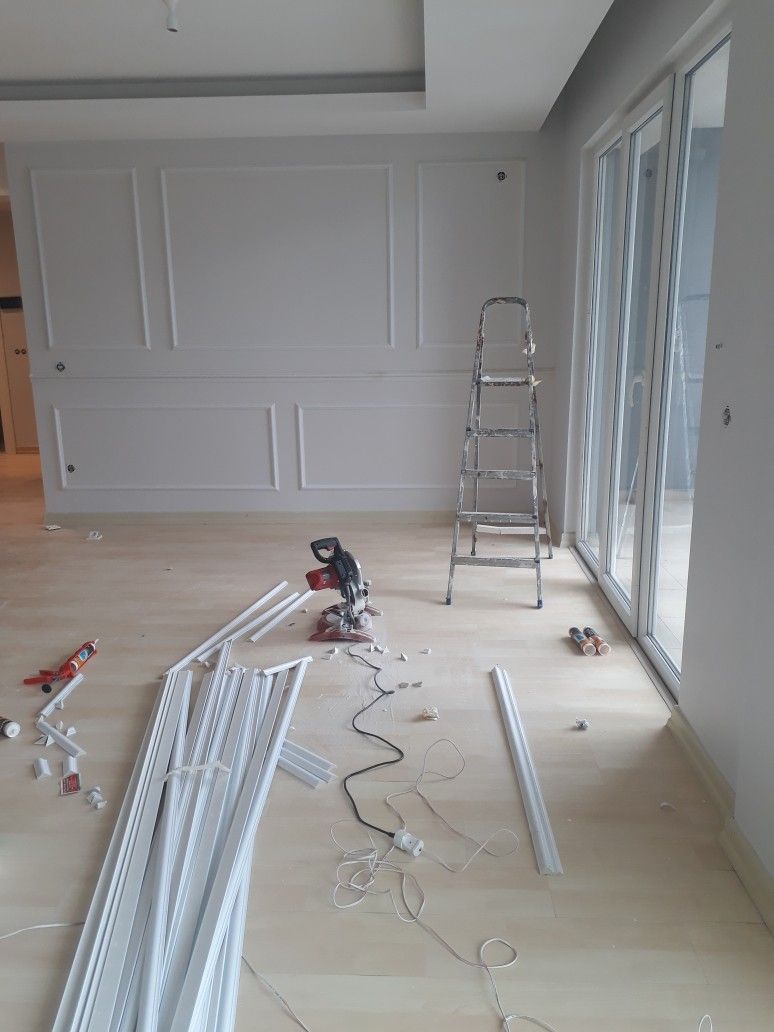 Workers applying wall plaster