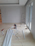 Workers applying wall plaster